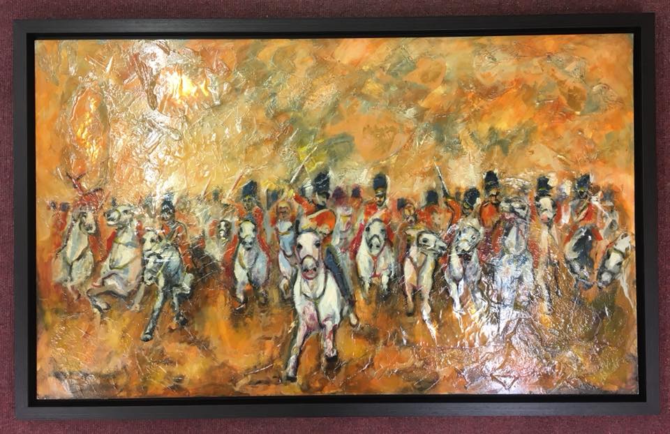 Painting of a cavalry in a black frame